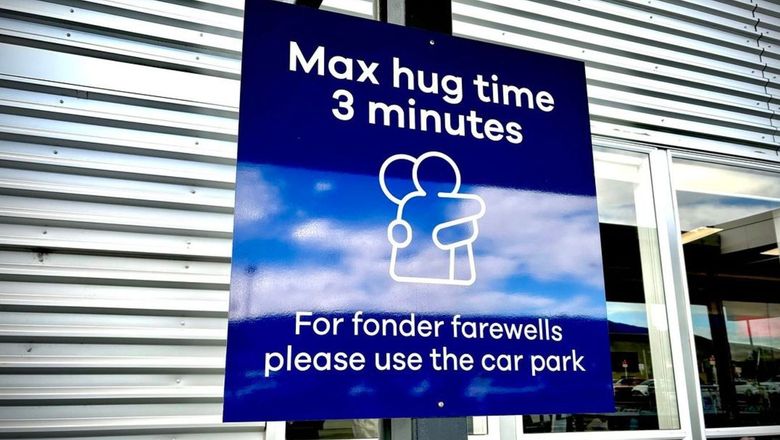 Dunedin Airport has installed signs to remind travellers of the three-minute limit on farewell hugs.